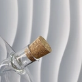 Detail shot of a transparent glass oil bottle neck sealed with a natural cork stopper - Spare Cork Stoppers