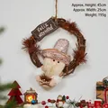 Christmas rattan wreath with Feliz Navidad sign and gnome doll on a white wall - Small Brown Rattan Wreath - Santa