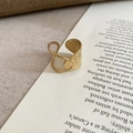 Detail view of warm gold ring with hammered texture on vintage book background - Wide Hammered Cross Texture / No.10 Ring-Gold