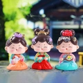 Three cute Tang dynasty style resin figurines wearing hanfu on stone background - Mengqu Shaking Head Set 3 Pcs
