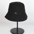 Women's UV protection black sun hat on display stand with minimalist metal emblem - Adjustable / Black