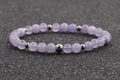 Lavender purple 6mm beaded bracelet with silver accent spacers on black background - 6MM Light Purple
