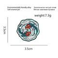 Artistic double fish enamel pin with yin yang design in blue and white colors - Yin Yang Fish Wings