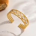 Elegant gold-plated stainless steel open cuff bracelet with white enamel shuttle inserts - Gold White Oval Inlay
