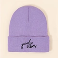 Detail of light purple knitted beanie with black good vibes embroidery on front fold - Light Purple