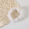Detail of white pearl elastic hair tie placed on minimalist lace background - OPP Bag / Pure White