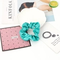 Teal blue satin scrunchie with a glossy finish displayed on a white lace plate - 24#-Cyan