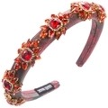Macro shot of Baroque red rhinestone headband showing Hand Made label and craftsmanship - Red
