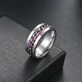 Macro view of rotatable titanium steel chain ring with colorful rainbow link inlay - Colorful