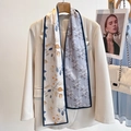 Pink silk long scarf with leaf pattern draped over a beige blazer for women - Rainforest Leaves