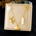Gold ocean theme bracelet with crab shell and pearl charms on a professional stand - Bracelet (N3713)