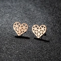 Rose gold hollow heart earrings with geometric mesh texture on a textured black surface - Heart / Rose Gold