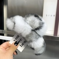 Detail of plush faux rabbit fur hair claw clip in white and grey with fluffy texture - Extra Large / White Leopard