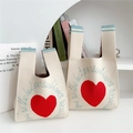 Borsa tote in maglia crema con motivo a cuore rosso e manico a righe per regali - Cuore Rosso