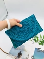 Handheld woven turquoise envelope clutch bag with intricate straw texture and strap - Blue
