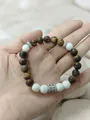 Brown tiger eye and white lava stone beaded bracelet with silver floral spacers - Matte Tiger Eye