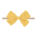 Detail of yellow linen bow on soft beige nylon baby headband for newborn styling - Bright Yellow