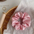Elegant pink satin scrunchie with soft silk texture and high-gloss pleated design - Pink