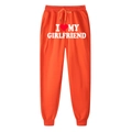 Orange joggers featuring I Love My Girlfriend print and red heart design with cuffed hems - S / Orange (Girlfriend)