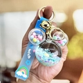 Blue Mickey head keychain with liquid sand, rainbow silicone strap, and gold bell - Blue