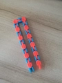 24-link wacky tracks sensory toy in blue and orange colors on a wooden surface - Blue and Orange