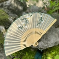 Handmade silk folding fan with floral embroidery and bamboo ribs with green tassel - Gardenia