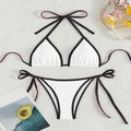 Two-piece contrast bikini set with halter top and side-tie bottoms in white and black - White
