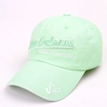 Detail of mint green washed cotton baseball cap with New Orleans jazz embroidery - Grass Green