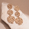 Detailed view of gold triple spiral drop earrings with hammered texture on stone - Steel Needle (Eco-friendly) / Gold