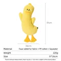 Funny yellow duck plush dog toy with crown and squeaker made of soft rabbit-like fur - Tilted Head Duck