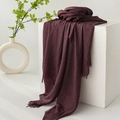 Deep red cotton linen scarf with fringe edges displayed on a minimalist white prop - Dark Mauve