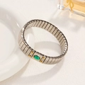 Silver stretch bracelet with gold rivets and an oval green gemstone centerpiece - J017-1 Silver Green Gem Star
