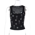 Dettaglio del crop top nero in maglia a coste con ricami floreali in strass - S / Nero