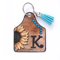 Western style leather keychain with sunflower, letter K, and blue fringe tassel detail - Letter K
