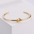 Bracciale aperto dorato con nodo minimalista in acciaio inossidabile lucido per donna - Oro