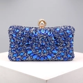 Macro detail of luxury evening clutch with blue and silver floral rhinestones and pearl clasp - Blue