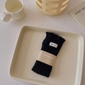 Vertical ribbed black mid-calf socks with label and smile face paper band packaging - One Size / Black