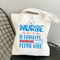 Nurse in Progress canvas tote bag on metal chair with heart rate and hat graphic - Style C6 (No Inner Pocket/No Zipper)