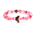 Pink agate and goldstone beaded bracelet with a butterfly pendant on a white background - Peach Pink + Goldstone Butterfly