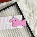 Cute pink puppy hair clip with blue striped birthday hat on a minimalist love card - Pink Dog