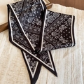 Detail of black paisley silk scarf necklace with satin texture and pointed ends - Necklace-Black