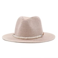 Detail of breathable straw sun hat featuring white oval beads and leather trim band - Nude Pink