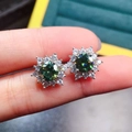Classic silver stud earrings featuring a round green gemstone with white halo diamonds - Sunflower Green Zirconia Studs (ED124)