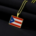 Close-up of golden Puerto Rico flag pendant necklace on black quilted texture - Gold Necklace A (Rectangle Flag)