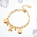 Golden double-strand chain bracelet with Queen coin and letter X pendant on ice - Letter X
