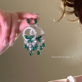 Macro detail of vintage emerald earrings with green stones and silver bow design - Silver Butterfly Tassel Clip (28#)