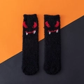 Fuzzy black Halloween crew socks featuring a red devil face pattern with horns - One Size / Black Red Horned Devil