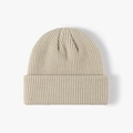 Thick ribbed knit beanie in oat beige color with a wide fold-over cuff for winter warmth - Withered Yellow