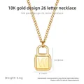 Detail view of 18K gold letter W padlock pendant with dimensions 14.8mm x 9.7mm and 3.6g weight - Letter W