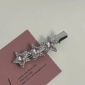 Detailed close-up of silver star hair pins with pink crystals and sparkling white rhinestones - Silver/Pink Zirconia-Three Stars